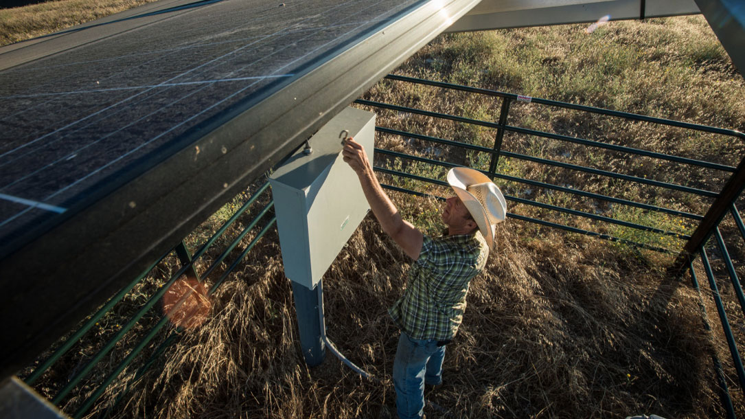 Rancher Installing Solar Panel